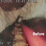 Sewer line before cleaning — heavy build-up